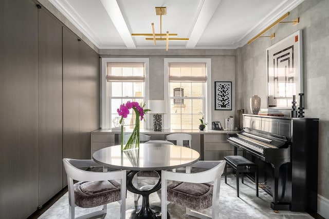 dining space featuring finished concrete flooring, ornamental molding, and beam ceiling