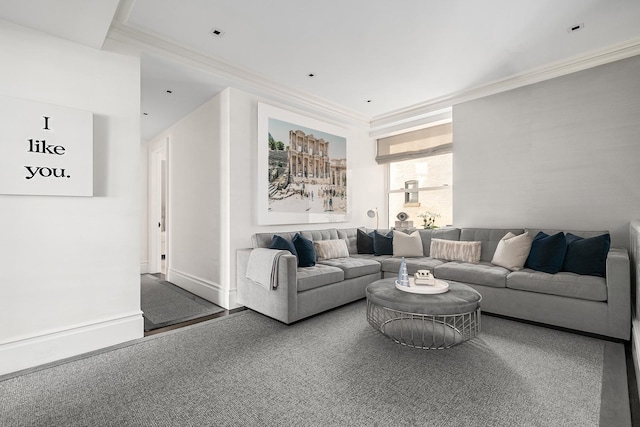living area featuring crown molding, baseboards, and carpet