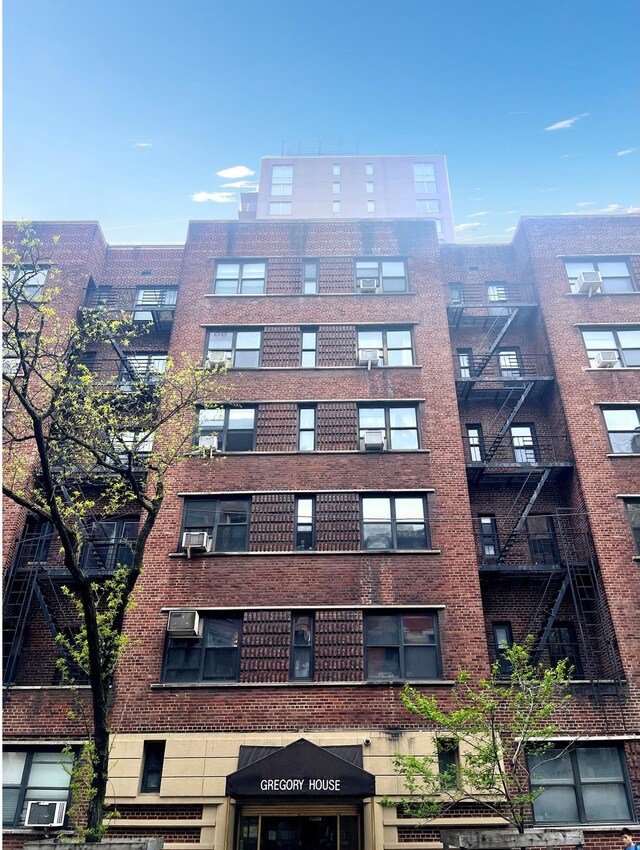 view of property featuring a wall mounted AC