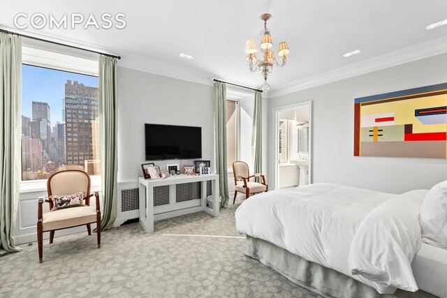 bedroom featuring carpet floors, an inviting chandelier, ensuite bath, and crown molding