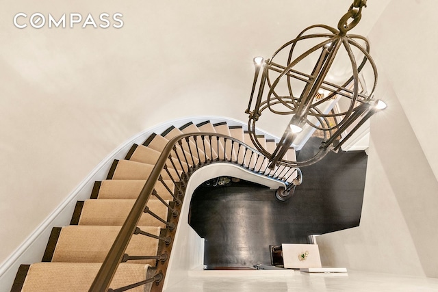435 E 52nd St Unit 16C2, New York City, NY 10022 - staircase with a chandelier