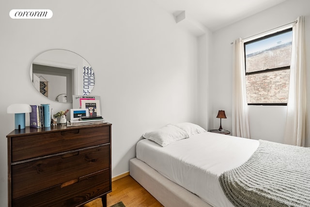 bedroom with light hardwood / wood-style floors