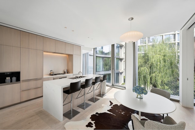 160 Leroy St Unit South5A, New York City, NY 10014 - dining area with light wood finished floors and expansive windows