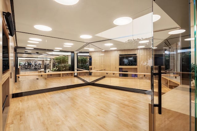 carpeted dining space with track lighting