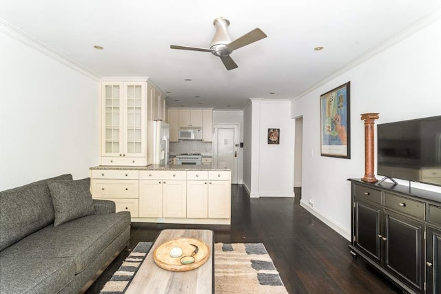 living room with dark wood-type flooring, crown molding, and ceiling fan