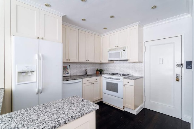 kitchen featuring light stone counters, white appliances, white cabinets, and dark hardwood / wood-style floors