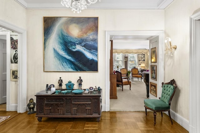 hallway with parquet floors, a chandelier, and ornamental molding