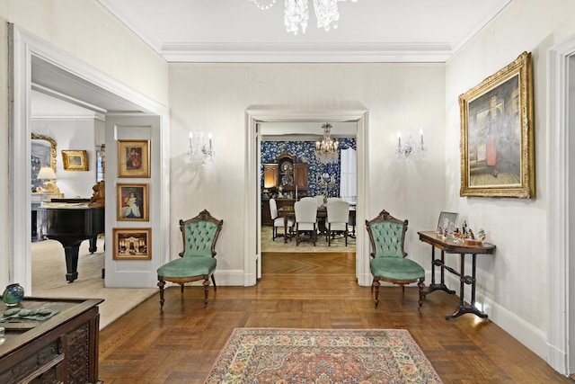 sitting room with a notable chandelier and crown molding