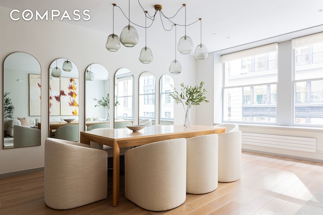 dining space with light wood-style flooring