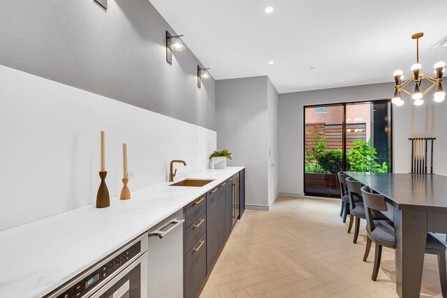 107-06 Queens Blvd Unit 7-G, New York City, NY 11375 - bar area with a chandelier, baseboards, a sink, recessed lighting, and pendant lighting