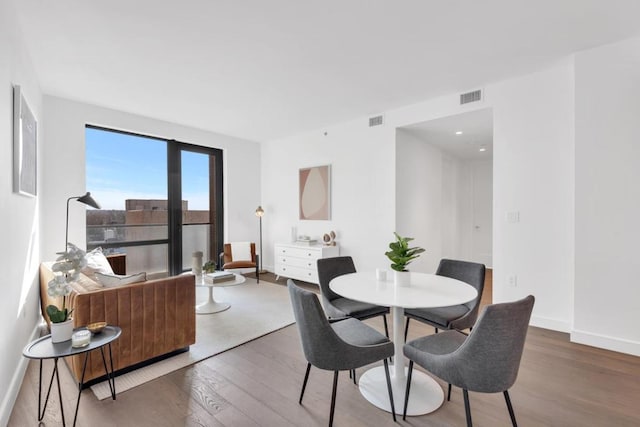 dining area with hardwood / wood-style flooring