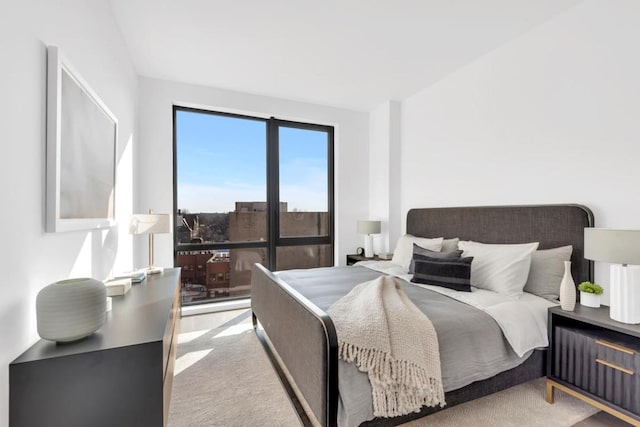 bedroom featuring light colored carpet