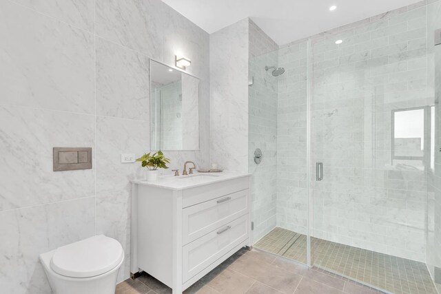 107-06 Queens Blvd Unit 7-G, New York City, NY 11375 - full bathroom with tile walls, a shower stall, vanity, toilet, and tile patterned flooring