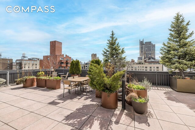 201 W 21st St Unit 7D, New York City, NY 10011 - view of patio / terrace with a view of city and outdoor dining space