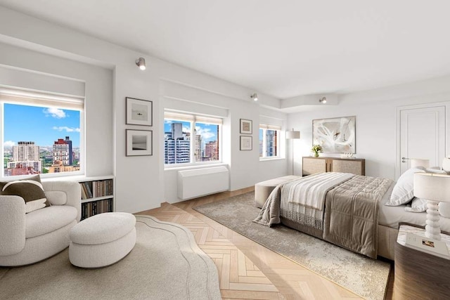 bedroom with light parquet flooring