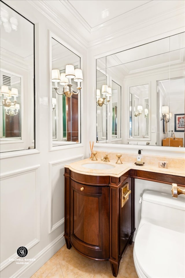 half bathroom featuring toilet, tile patterned floors, crown molding, and vanity