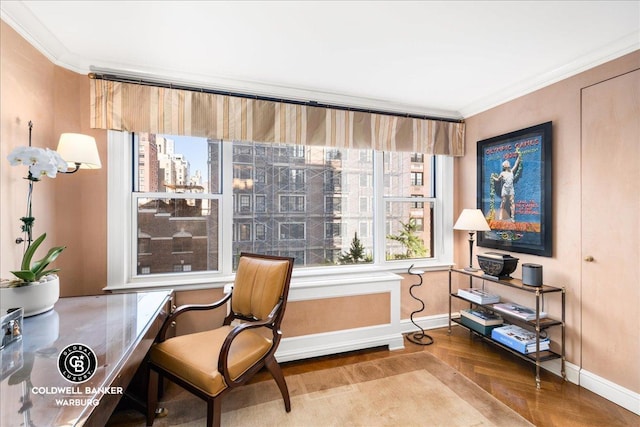 living area featuring ornamental molding, a city view, baseboards, and wood finished floors