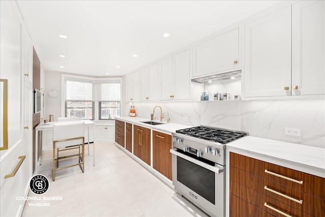 kitchen featuring open shelves, a sink, gas range, and white cabinetry