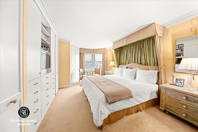 bedroom with ornamental molding and light colored carpet