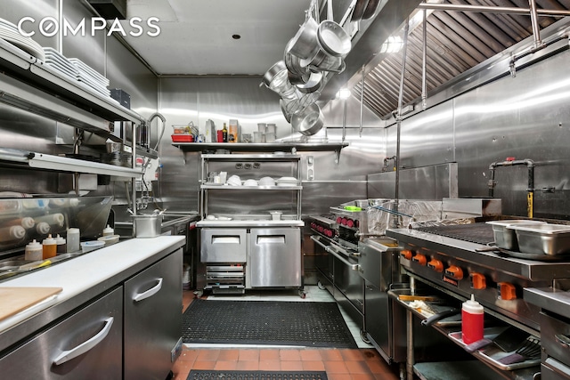 kitchen with light countertops and dark tile patterned flooring