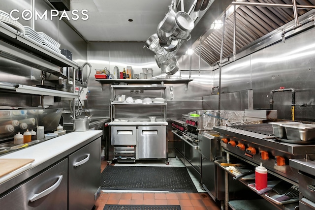 397 5th Ave, New York City, NY 11215 - kitchen with dark tile patterned floors, light countertops, and high end stainless steel range