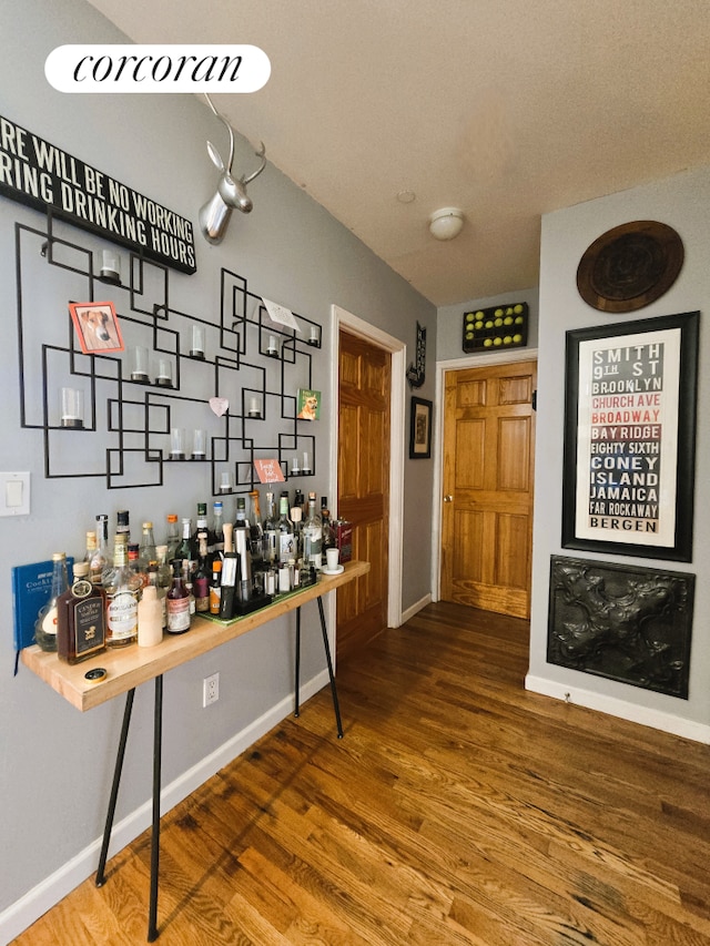 563 20th St, New York City, NY 11218 - indoor dry bar with wood finished floors and baseboards