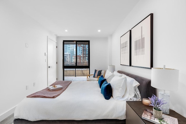 bedroom with wood-type flooring