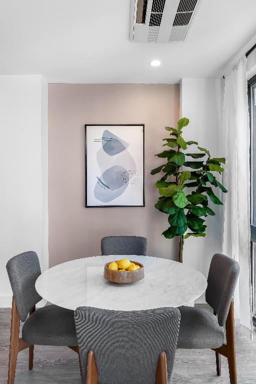 dining room featuring visible vents, wood finished floors, and recessed lighting