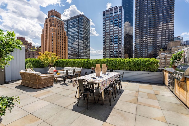 view of patio with a view of city, outdoor dining area, and an outdoor hangout area