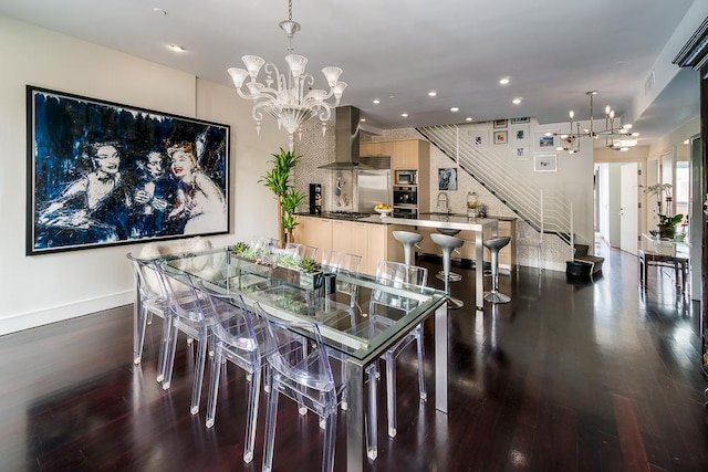 dining area featuring stairway, recessed lighting, wood finished floors, and an inviting chandelier