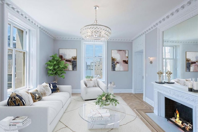 living room featuring an inviting chandelier, crown molding, a wealth of natural light, and light parquet floors