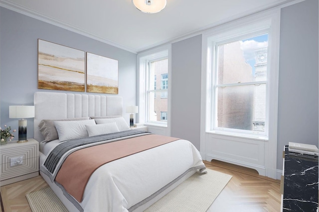 bedroom with baseboards and crown molding