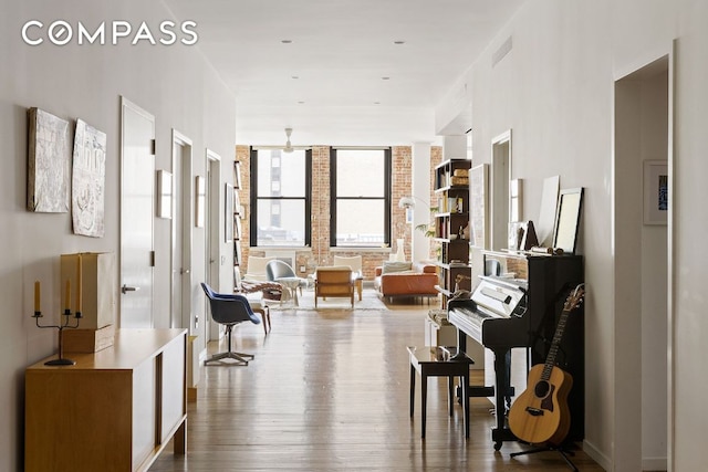 interior space featuring wood-type flooring and floor to ceiling windows