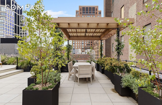 view of patio / terrace featuring outdoor dining space and a pergola