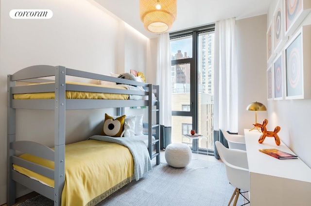 bedroom featuring floor to ceiling windows