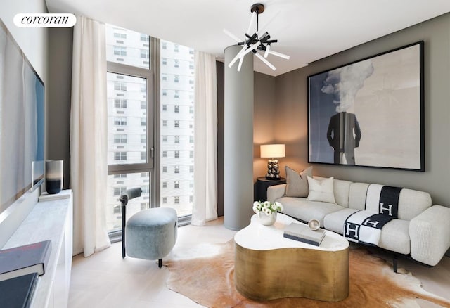 living room featuring expansive windows and a notable chandelier