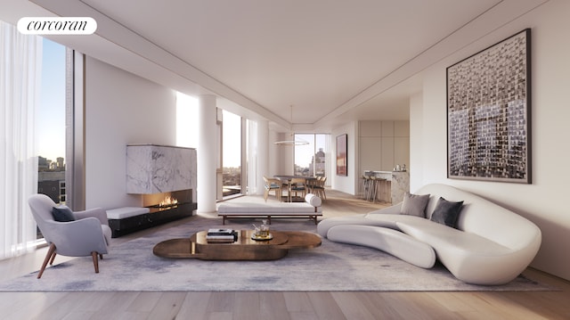 living area featuring visible vents, wood finished floors, and a fireplace