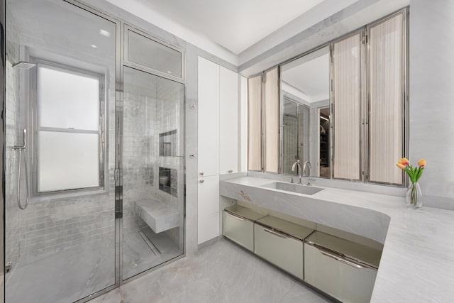 bathroom with vanity and a shower stall