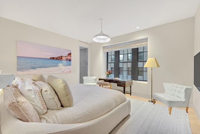 bedroom featuring recessed lighting and wood finished floors