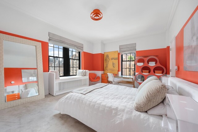 carpeted bedroom featuring crown molding