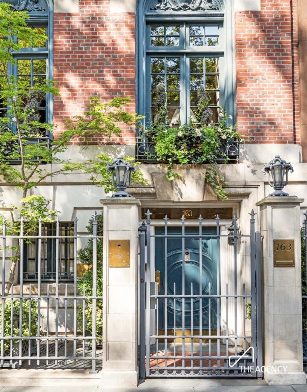 entrance to property featuring brick siding