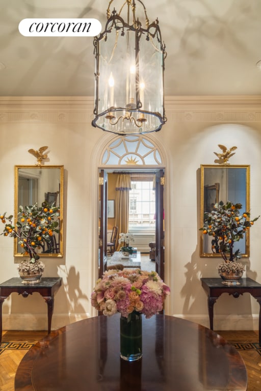 dining space with a notable chandelier and ornamental molding