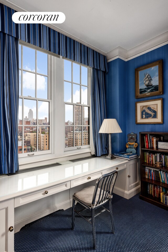 hall with parquet floors, crown molding, and a chandelier