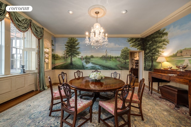 dining space featuring a notable chandelier, crown molding, and hardwood / wood-style flooring