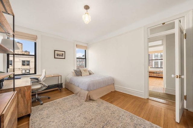 bedroom with hardwood / wood-style flooring