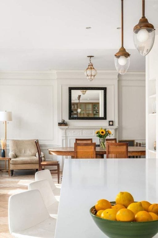 interior space with hanging light fixtures, light hardwood / wood-style flooring, and ornamental molding