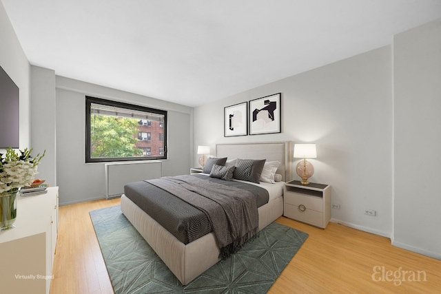 bedroom with light hardwood / wood-style floors