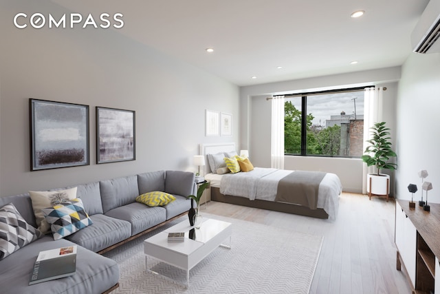 bedroom with light wood-type flooring, an AC wall unit, and recessed lighting