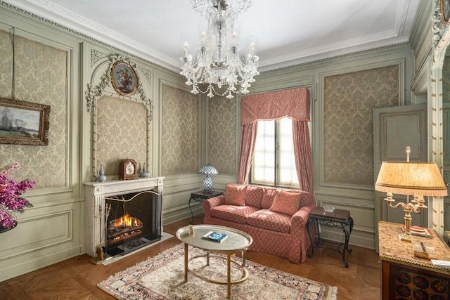 sitting room featuring parquet floors, a notable chandelier, and ornamental molding