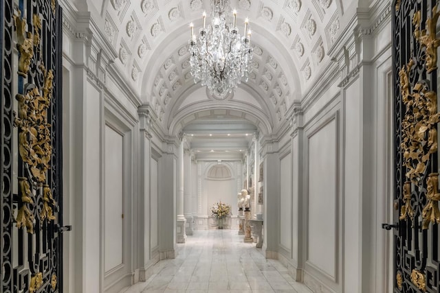 hallway with a chandelier